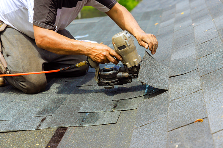 man-shingles-roof