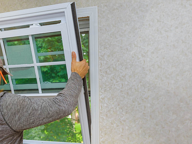 Worker installing new windows