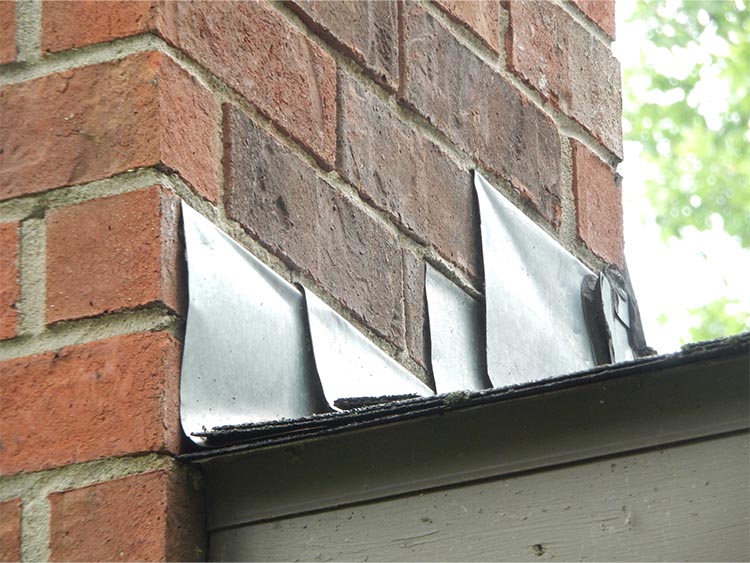 Lifted flashing near a chimney.