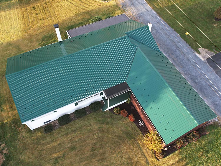 Green metal roof on residential home.