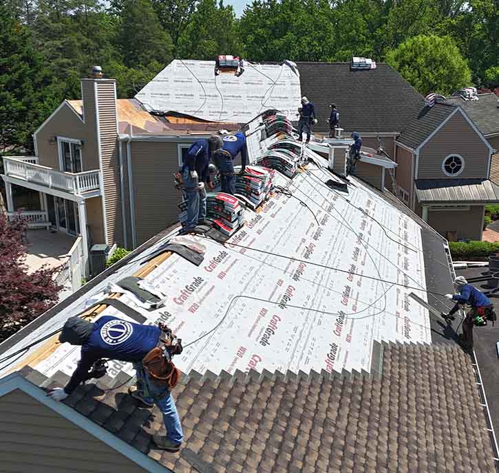 AC Matthews roofers installing a shingle roof.