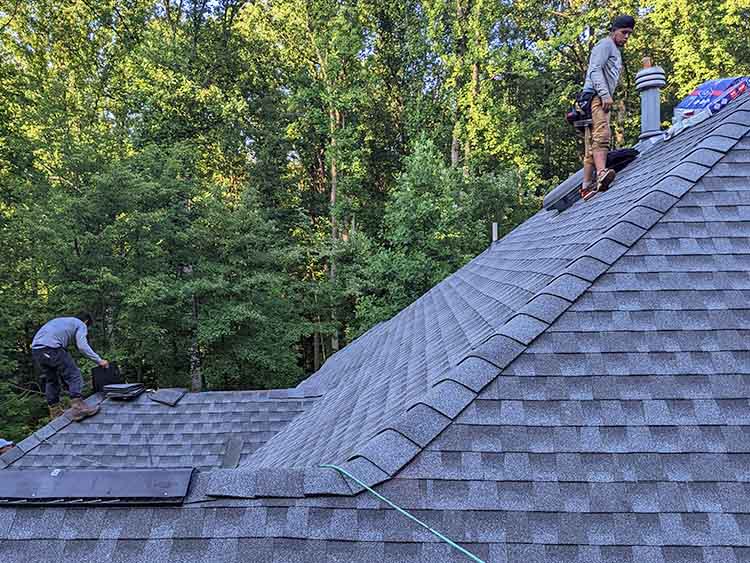 AC Matthews roofers installing new roof.